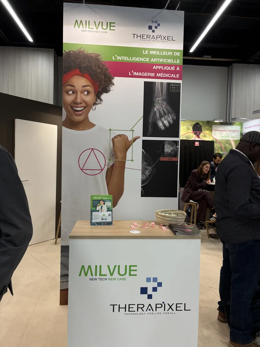 The totem and reception desk of the booth Milvue and Therapixel shared at JFR 2026